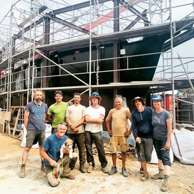 The crew who built and broke down the protective cocoon around the ship.